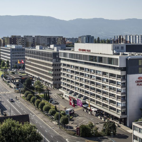 Exterior view of Crowne Plaza Geneva, located just steps from the airport, combining elegance and convenience.
